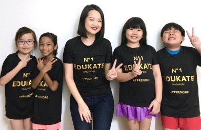 Tutor Yuet Ling with Primary Students and our Semester 2017 T Shirts.